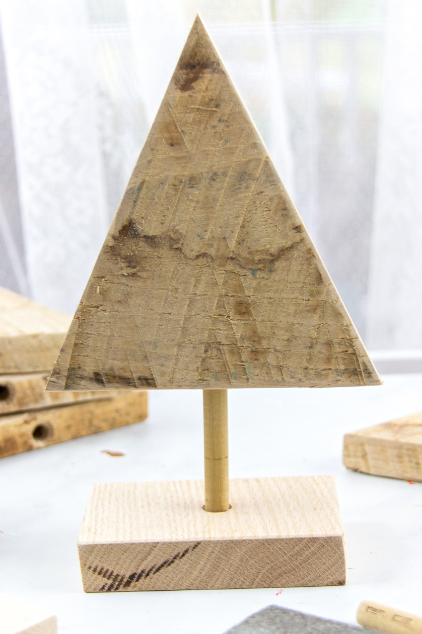 wood triangle, dowel rod and wood block used to make a tree woodcraft project for preschoolers