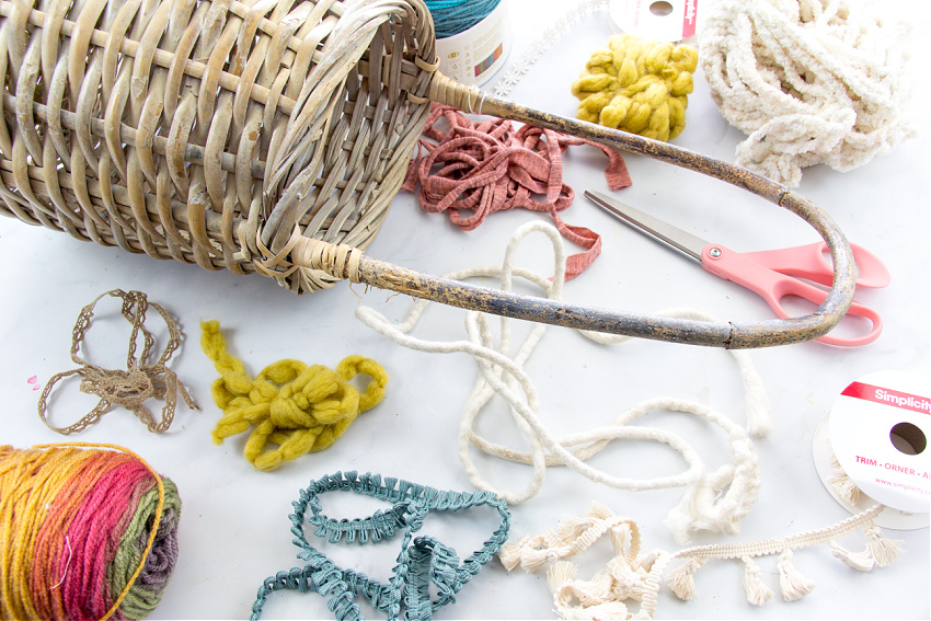 ribbon, fabric, and yarn to make a fringe for a diy boho basket