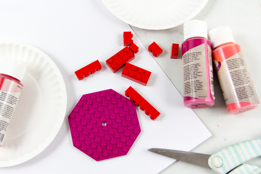 gather lego pieces, card stock, paint, and string to make lego valentines cards