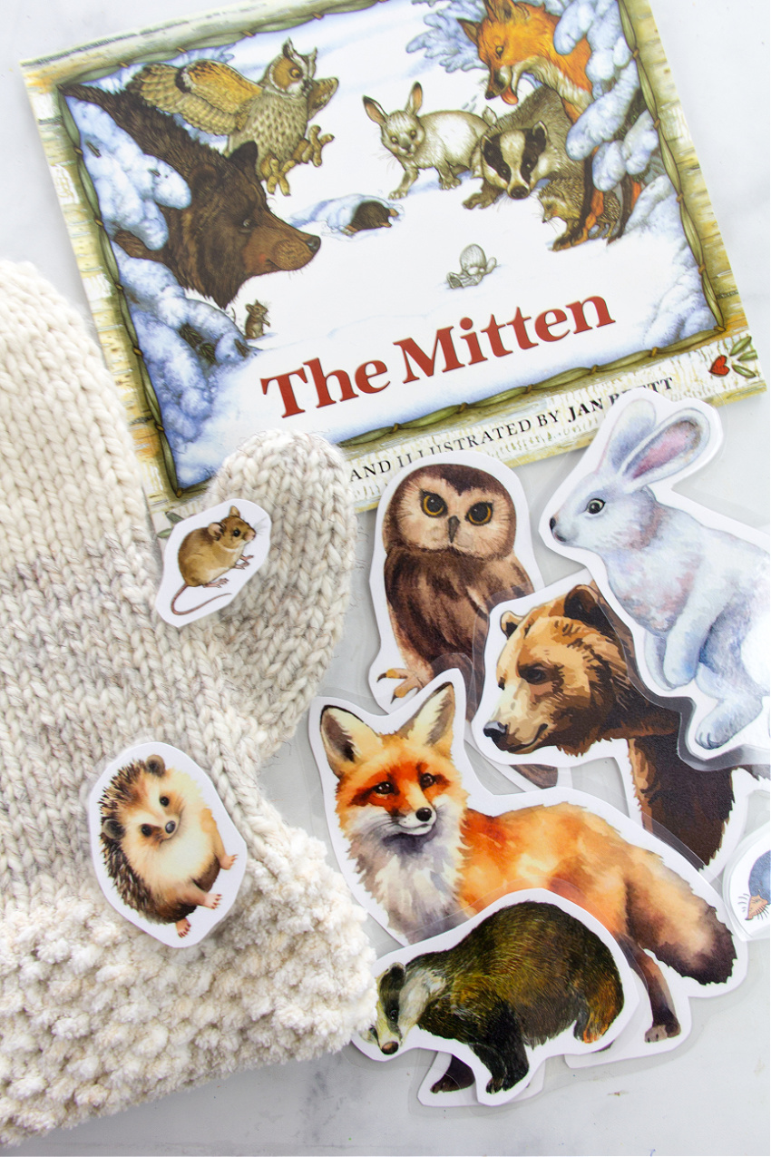 the mitten book with animals from the book and a knit mitten