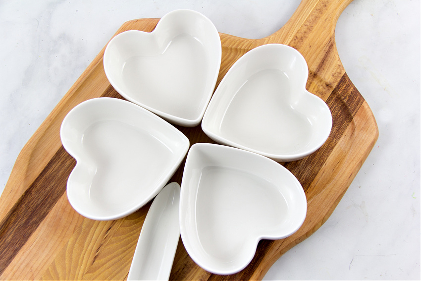 heart shaped bowls arranged into the shape of a four leaf clover for st patricks day food
