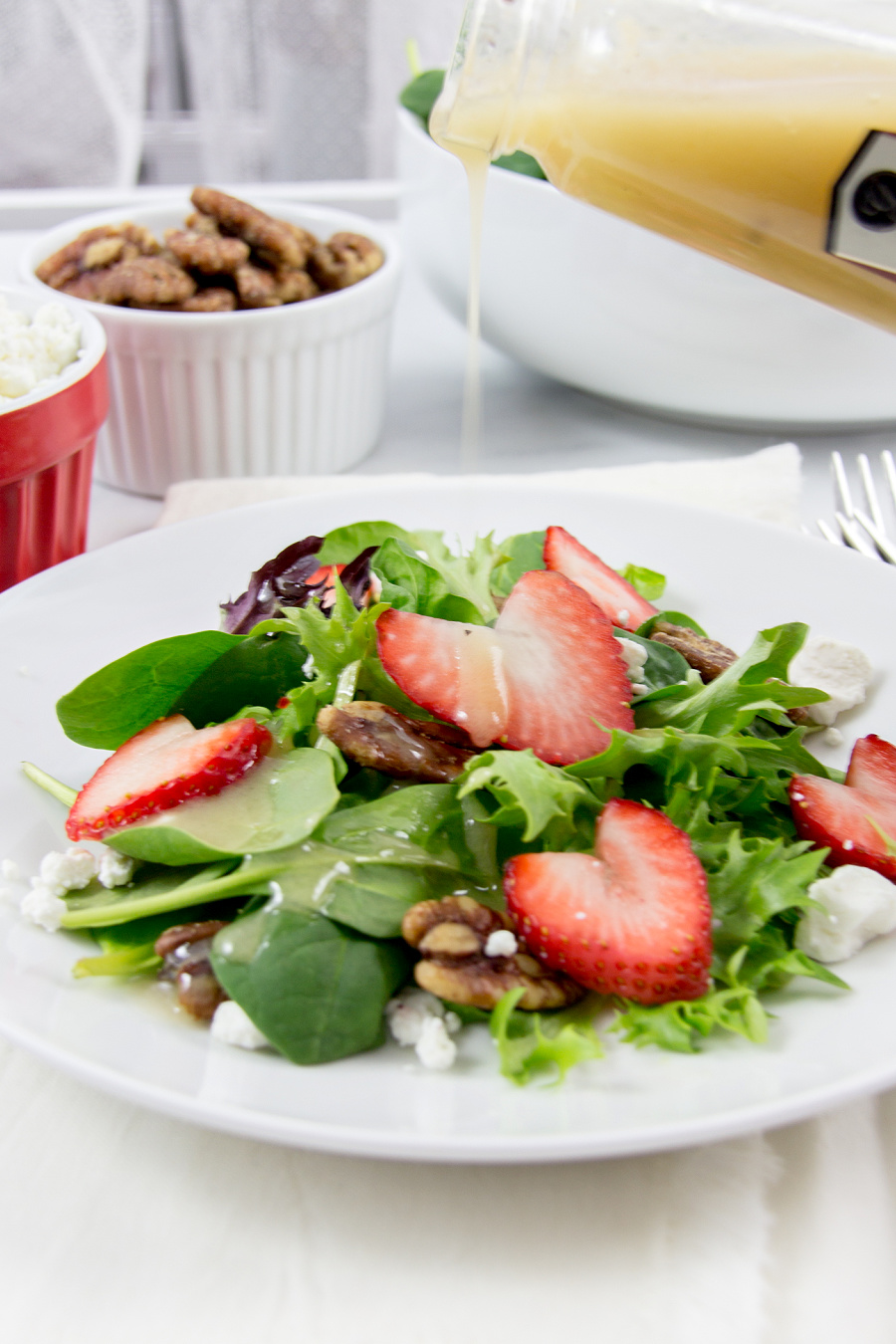 A Valentine's Day salad with heart shaped strawberries