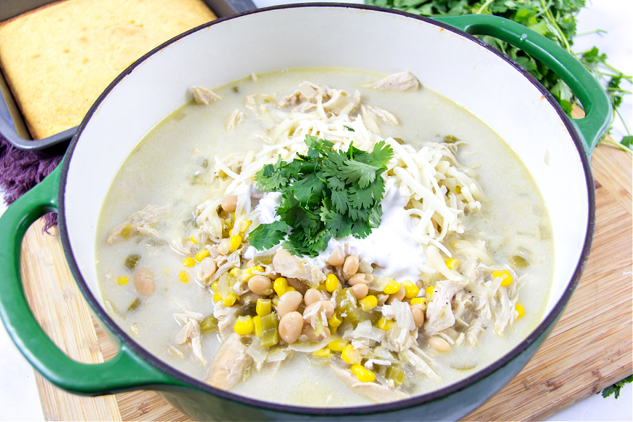 white chicken chili topped with cilantro, crema mexicana and monterey jack cheese