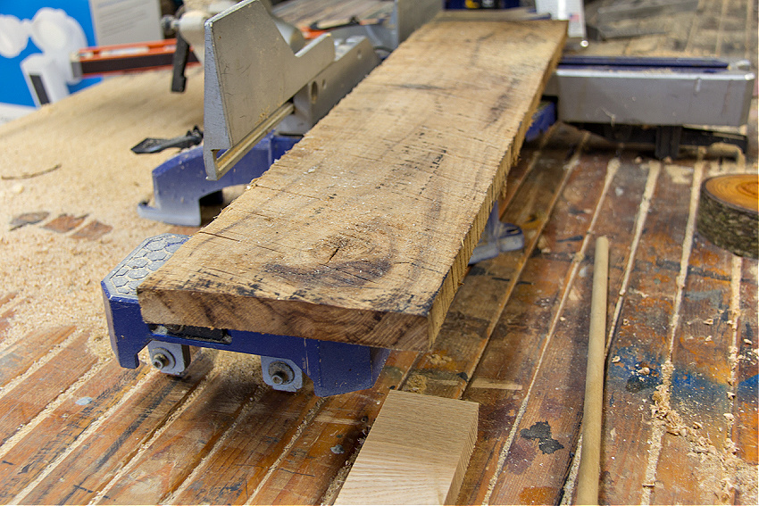 a slab of wood being cut to make wood trees for Christmas