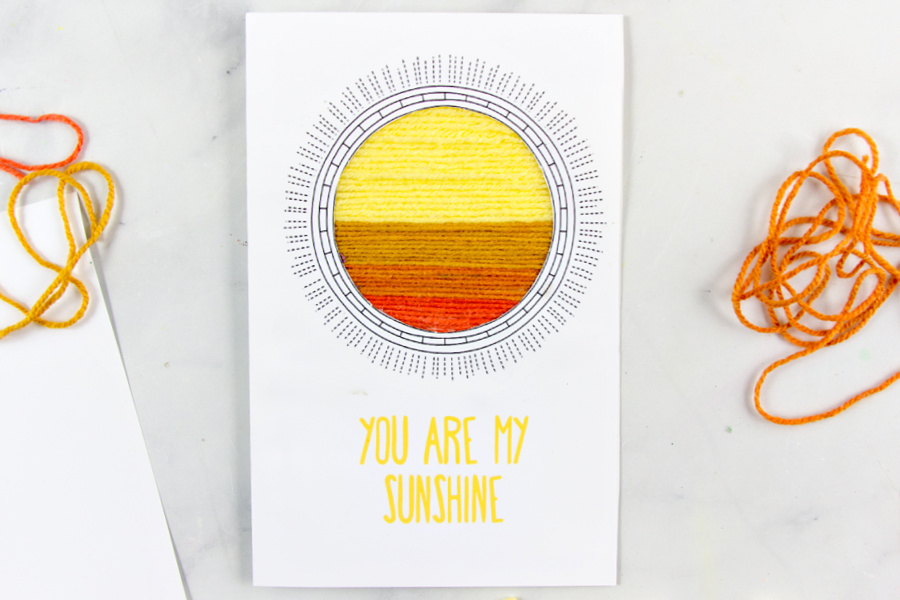 a homemade greeting card with a yarn scraps sun with the words you are my sunshine